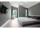 Large bedroom with a king-size bed and grey walls at 2225 Millbank Village Ct # 101, Raleigh, NC 27610