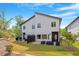 Modern home with backyard patio, garden planters, and privacy fence at 2225 Millbank Village Ct # 101, Raleigh, NC 27610