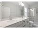 Bathroom with double vanity, marble shower, and modern fixtures at 119 White Oak Gdn Way # 52, Garner, NC 27529