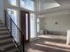 Entryway with wood floors, staircase with modern railing, and large windows at 196 Mountaintop Cir, Pittsboro, NC 27312