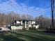 Modern two-story home with a landscaped yard and attached garage at 196 Mountaintop Cir, Pittsboro, NC 27312