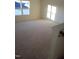 Spacious bedroom with carpeted floor and window at 432 Old Fashioned Way Way, Lillington, NC 27546