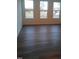 Bright and airy living area with three large windows and hardwood floors at 432 Old Fashioned Way Way, Lillington, NC 27546