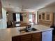 Kitchen island with sink and dishwasher overlooks dining and living areas at 747 Brewers Glynn Ct, Wake Forest, NC 27587