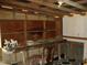 Small interior room with wooden shelving and worktable at 6349 Elevation Rd, Benson, NC 27504