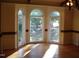 Dining room with hardwood floors and arched windows at 6349 Elevation Rd, Benson, NC 27504