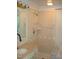 Bathroom with tiled shower, vanity with marble top and built-in shelves at 6349 Elevation Rd, Benson, NC 27504