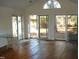 Living room with hardwood floors and glass doors at 6349 Elevation Rd, Benson, NC 27504