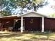 Outbuilding entrance with white columns and unique decor at 6349 Elevation Rd, Benson, NC 27504