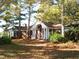Brick ranch house with covered porch and mature trees at 6349 Elevation Rd, Benson, NC 27504