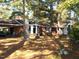 Brick ranch home with mature trees and landscaping at 6349 Elevation Rd, Benson, NC 27504