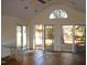 Sunlit living room with hardwood floors and sliding glass doors at 6349 Elevation Rd, Benson, NC 27504