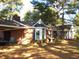 Brick ranch house with covered carport and landscaped yard at 6349 Elevation Rd, Benson, NC 27504
