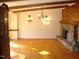 Hardwood floor living room with chandelier and fireplace at 6349 Elevation Rd, Benson, NC 27504