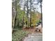 Private backyard with lush greenery and a tree-lined setting at 3419 Oak Trl, Clayton, NC 27520