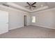 Bright main bedroom with carpet, ceiling fan and window views at 110 Lemon Drop Ln, Franklinton, NC 27525