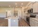 Modern kitchen with granite countertops, island and stainless steel appliances at 110 Lemon Drop Ln, Franklinton, NC 27525