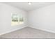 Bright bedroom with carpet and a large window at 110 Lemon Drop Ln, Franklinton, NC 27525
