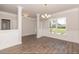 Bright dining room with hardwood floors and columns at 110 Lemon Drop Ln, Franklinton, NC 27525
