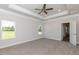 Spacious main bedroom with carpet, tray ceiling and ceiling fan at 110 Lemon Drop Ln, Franklinton, NC 27525