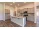 Modern kitchen with granite countertops and stainless steel appliances at 110 Lemon Drop Ln, Franklinton, NC 27525