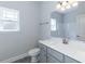 Bathroom with gray vanity and a shower at 110 Lemon Drop Ln, Franklinton, NC 27525