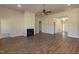 Open living room with hardwood floors, fireplace and large windows at 110 Lemon Drop Ln, Franklinton, NC 27525
