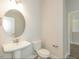 Small bathroom with a pedestal sink and toilet at 110 Lemon Drop Ln, Franklinton, NC 27525