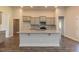 Open concept kitchen with granite countertops and an island at 110 Lemon Drop Ln, Franklinton, NC 27525