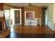 Living area with hardwood floors and brick fireplace at 6383 Elevation Rd, Benson, NC 27504