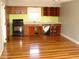 Kitchen with wood cabinets and hardwood floors at 6383 Elevation Rd, Benson, NC 27504
