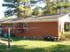 Brick house exterior with bikes and AC unit at 6383 Elevation Rd, Benson, NC 27504
