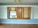 Bedroom with built-in shelving and hardwood floors at 6383 Elevation Rd, Benson, NC 27504