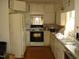 Kitchen with appliances and wood floors at 6383 Elevation Rd, Benson, NC 27504