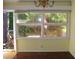 Dining area with large multi-pane window and chandelier at 6383 Elevation Rd, Benson, NC 27504