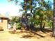 Brick and white ranch home with partial view of side yard at 6383 Elevation Rd, Benson, NC 27504