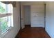 Simple bedroom with wood floors and window at 6383 Elevation Rd, Benson, NC 27504