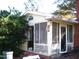 Rustic screened porch with peeling paint needs updating at 6383 Elevation Rd, Benson, NC 27504