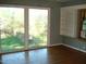 Room with hardwood floors and sliding glass doors at 6383 Elevation Rd, Benson, NC 27504