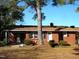 Brick ranch house with covered porch and landscaping at 6383 Elevation Rd, Benson, NC 27504