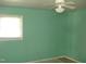 Light green bedroom with window and ceiling fan at 6383 Elevation Rd, Benson, NC 27504