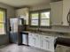 Updated kitchen with stainless steel appliances and granite countertops at 302 E D St, Erwin, NC 28339