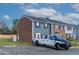 Exterior view of townhome with parking and surrounding area at 1812 Orange Grove Rd # 101, Hillsborough, NC 27278
