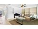 L-shaped living room with built-in shelving, rocking chair and ceiling fan at 1812 Orange Grove Rd # 101, Hillsborough, NC 27278