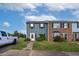 Front view of charming two-story townhome with landscaping at 1812 Orange Grove Rd # 101, Hillsborough, NC 27278