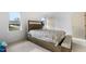 Charming bedroom with a queen-size bed, window, and storage bench at 1812 Orange Grove Rd # 101, Hillsborough, NC 27278