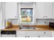 Kitchen features wood countertops, a double sink, and a view of the backyard at 1812 Orange Grove Rd # 101, Hillsborough, NC 27278