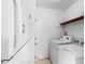 Neat laundry room with washer and dryer, and additional shelving at 1812 Orange Grove Rd # 101, Hillsborough, NC 27278