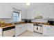 Bright kitchen with wood countertops, white cabinets, and stainless steel appliances at 1812 Orange Grove Rd # 101, Hillsborough, NC 27278