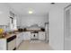 Bright kitchen with white cabinets, wood countertops, and appliances at 1812 Orange Grove Rd # 101, Hillsborough, NC 27278